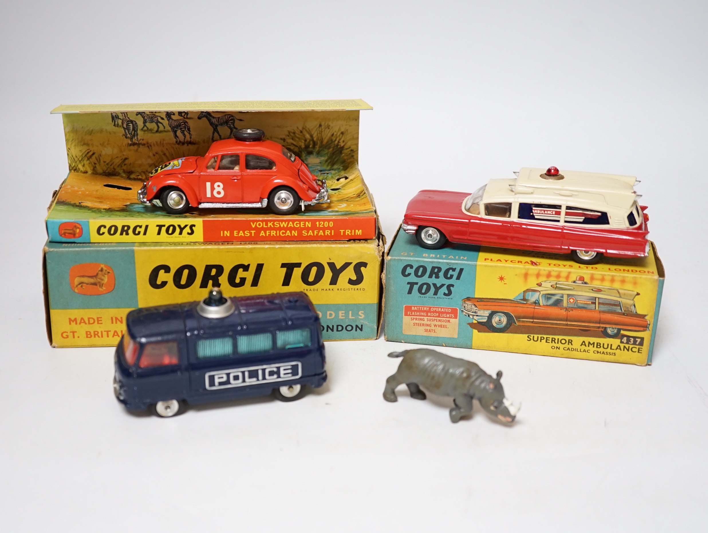 Three Corgi Toys including (256) Volkswagen 1200 in East African safari trim (with rhino and inner display stand), (437) Cadillac Superior Ambulance, both boxed, together with an unboxed Commer three-quarter ton police v